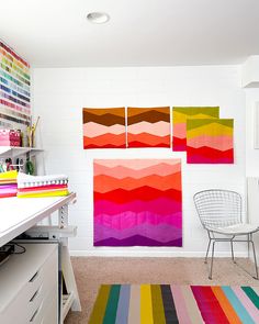 a room that has some colorful rugs on the floor