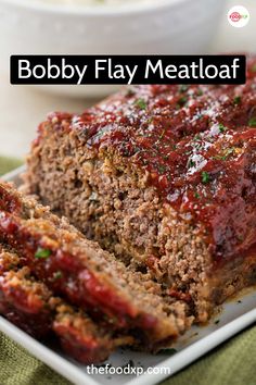 meatloaf on a plate with sauce and parsley