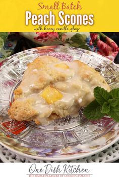 a small batch of peach scones on a glass plate with mint sprig