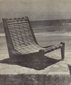 an old photo of a chair on the beach