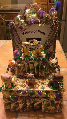 a cake made to look like it is decorated with beads and other things on the table