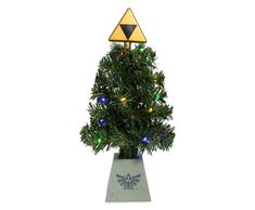 the legend of zelda christmas tree has lights on it's top and is in a pot