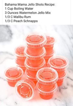 a pile of orange plastic cups sitting on top of a marble countertop next to each other