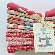 a stack of colorful fabric with a tag on the top that says scrap brimble