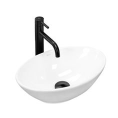 a white bowl sink with black faucet on the side and a black handle