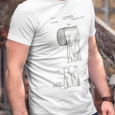 A Funny Dad Shirt Steeped In Scatological Humor This funny dad shirt features the original 1891 Toilet Paper Roll Patent. The funny dad tee shirt is for the man who appreciates the finer things. It’s a fathers day shirt that combines historical documentation with all day comfort. Get yours today! Ideal Gifts For Boyfriend or Dad: This unique novelty shirt will have the man in your life cracking a smile while he's cracking the porcelain. Available in: Blue, Black, White, and Charcoal. Sizes S-3X Toilet Paper Patent, Christmas Tee Shirts, Nerd Shirts, Dads Clothes, Funny Gifts For Dad, Funny Dad Shirts, Novelty Shirts, Vintage T Shirts, Fathers Day Shirts