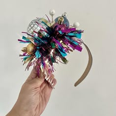 🎄XL adult Christmas tinsel headband fascinator  🎄These Alice bands are lightweight and comfy to wear. With a large sparkling silver disco ball, multi coloured festive tinsel and blue, purple and gold baubles on the side. 🎄These fun Christmas headbands are great for making a big statement over the festive season!  🎄Add with your favourite Christmas jumper or on its own, it's a great timeless statement piece that you can wear year after year.   🎄Best suited for adults due to the size  Lots of Tinsel Headband, Christmas Disco Ball, Christmas Headband Diy, Gold Baubles, Christmas Disco, Alice Bands, Christmas Headbands, Headband Fascinator, Holiday Headbands