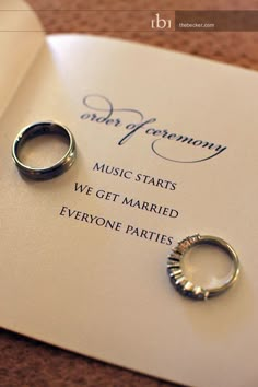 two wedding rings sitting on top of a piece of paper with the words, vows and ceremony music starts we get married everyone parties