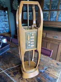 an old fashioned radio on top of a wooden table