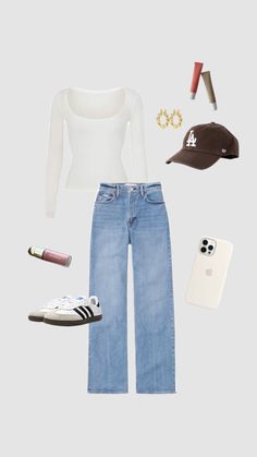 a white shirt, jeans and hat are arranged in the shape of a woman's head