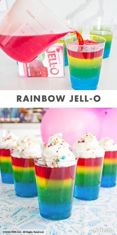 rainbow jello is being poured into small cups