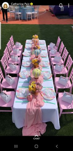 a table set up with pink chairs and plates