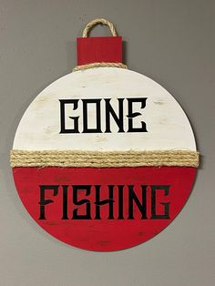 a red and white sign that says gone fishing