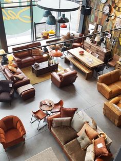 an overhead view of a living room with couches, chairs and tables in it