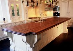 a large kitchen with an island and chandelier