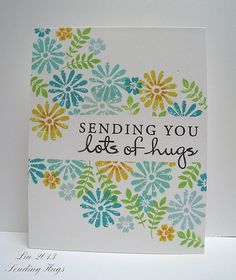 a handmade card with flowers and the words sending you lots of hugs on it