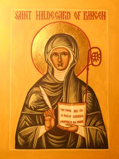 an icon of st hildegard of ergesen holding a paper and a flag