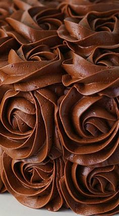 a close up of a cake with chocolate frosting