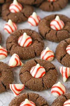 chocolate cookies with white and red candy canes on top