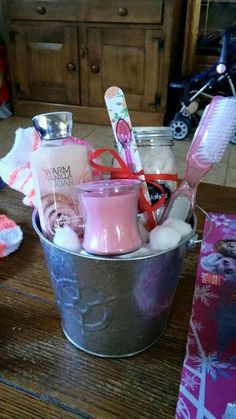 a bucket filled with personal care items on top of a wooden table