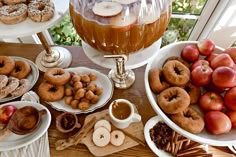 apples, donuts and other pastries are on the table