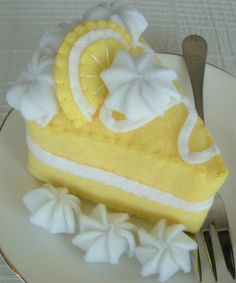 a slice of lemon cake on a plate with a fork