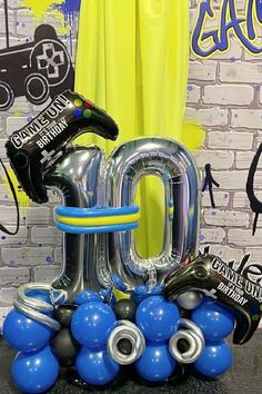 an image of balloons that are in the shape of letters and numbers on a table