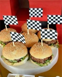 hamburgers with black and white checkered flags on them