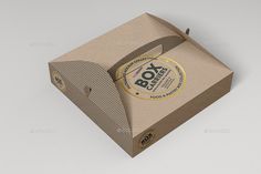 a cardboard box mockup with the lid open and an empty paper bag on top