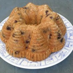 a bundt cake sitting on top of a blue and white plate