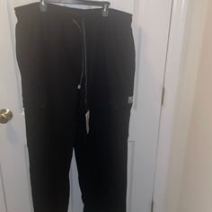 Comfortable Sweat Pants With Multiple Pockets And Adjustable. Black Full-length Joggers With Pockets, Black Full Length Joggers With Pockets, Black Wide Leg Joggers With Side Pockets, Utility Sports Bottoms Black, Black Utility Sports Bottoms, Black Utility Bottoms For Sports, Utility Black Bottoms For Sports, Black Joggers With Pockets, Black Straight Leg Cargo Pants For Sports