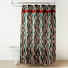 a shower curtain with red and green designs on it