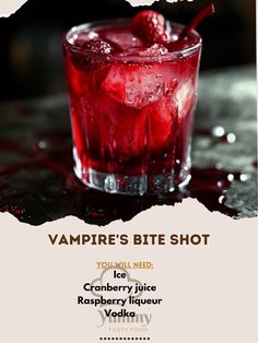 the vampire's bite shot is served in a glass with ice and cherries