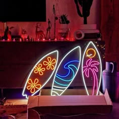 a neon surfboard sign sitting on top of a table