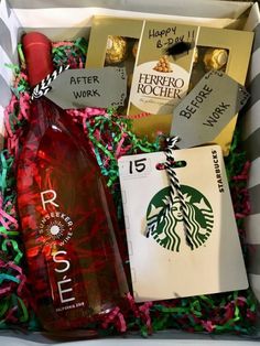 the starbucks gift box is filled with chocolates, wine and other items for someone's birthday