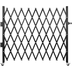 a black metal fence with wheels on it