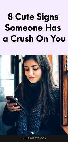 a woman looking at her cell phone with the text 8 cute signs someone has a crush on you