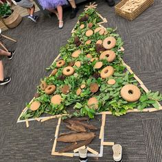 a christmas tree made out of doughnuts and leaves