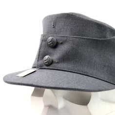 "Original Finnish army field cap Featuring leather sweatband, national crested buttons, and hole for regimental cockade Flaps fold down for cold weather. These are the same style used by the Finnish and Germany military during the WWII in the 1940's Condition - NEW. Please take note: Cap might have incorrect genuine size tags. For the most cap original size tag, it's specified 2 sizes larger or 2 sizes smaller. For example, you might find a genuine size tag on the cap \"55\", but the real size i Military Cap For Hunting, Military Style Hat With Short Brim, Cap Winter, Military Hat, Cool Hats, Cap Design, Wool Hat, Costume Design