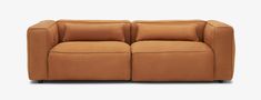 a brown couch with two reclinings and pillows on top of the back end