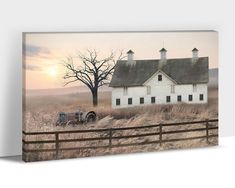 an old farm house with a tractor in the foreground and a bare tree behind it