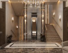 an elegant foyer with chandelier and marble floors