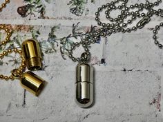 This urn/bottle necklace is an empty capsule to put pills in, sand, human or pet ashes or even a tiny note. The capsule unscrews at the top. The lid could be glued shut if you choose to do that. For men, women or children. I T E M • DETAIL: - PENDANT SIZE: Bottle measures 7/8" tall. It measures 3/8" wide at the bottom of the bottle. The opening measures 3/8" wide - CHAIN LENGTH: The necklace is a tiny bead ball chain measures 20" -MATERIAL: Stainless (Silver) and Gold Plated C A R E ∙ T I P S We Bead Ball, Bottom Of The Bottle, Urn Necklace, Pet Ashes, Urn Necklaces, Bottle Necklace, Ball Chain, Chain Length, Gold Plate