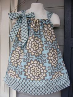 a blue and brown flowered top on a mannequin