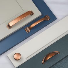 an assortment of door handles and knobs in various colors