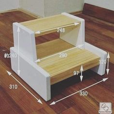 the step stool is made out of wood and has two shelves on each side, along with measurements