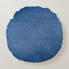 a round blue plate sitting on top of a white table