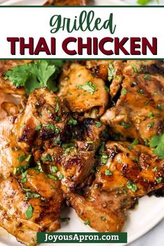 grilled thai chicken on a white plate with cilantro