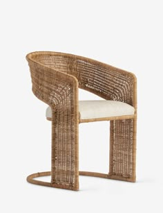 a wicker chair with a white cushion