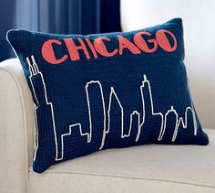 a chicago pillow sitting on top of a couch